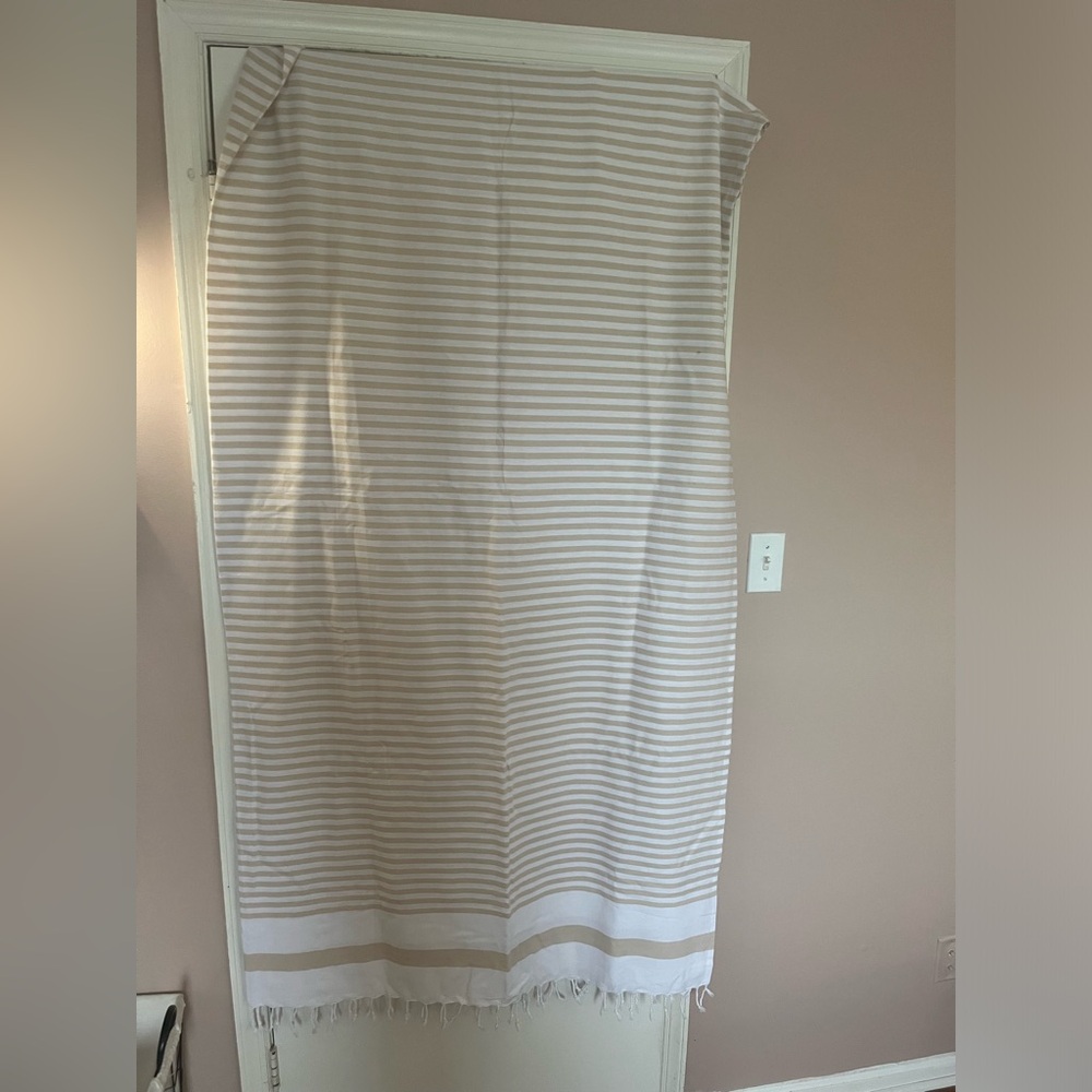 Beige & white stripped shower curtain.